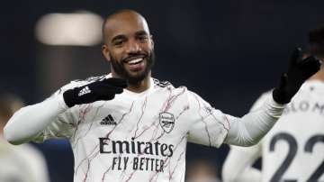 Arsenal's Alexandre Lacazette celebrates after scoring his side's first goal during the English Premier League soccer match between Brighton and Arsenal at the Falmer stadium in Brighton, England, Tuesday, Dec. 29
