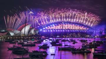 Fireworks explode over the Sydney Opera House and Harbour Bridge as New Year celebrations begin in Sydney, Australia.