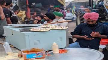 Those who give dough can also have pizza, say organisers of ‘pizza langar’ at farmers' protest