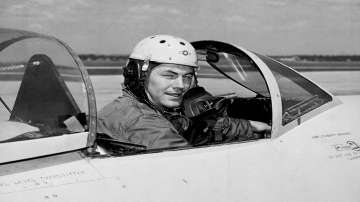 In this 1948 file photo, test pilot Charles E. Yeager, 25, poses for a picture in a jet's cockpit. 