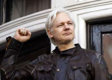 FILE - In this May 19, 2017 file photo, WikiLeaks founder Julian Assange greets supporters outside the Ecuadorian embassy in London, where he has been in self imposed exile since 2012. Judge Vanessa Baraitser has ruled that Julian Assange cannot be extradited to the US. because of concerns about his mental health, it was reported on Monday, Jan. 4, 2021. Assange had been charged under the US’s 1917 Espionage Act for “unlawfully obtaining and disclosing classified documents related to the national defence”.