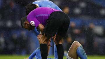 Manchester City's John Stones reacts injured at the ground during the English Premier League soccer match between Manchester City and Newcastle United at the Etihad Stadium in Manchester, England, Saturday, Dec., 26