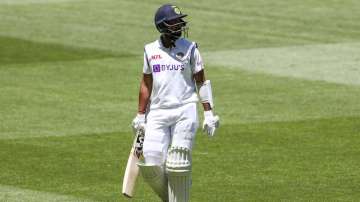 India's Cheteshwar Pujara walks from the field after he was dismissed during play on day four of the second cricket test between India and Australia at the Melbourne Cricket Ground, Melbourne, Australia, Tuesday, Dec. 29