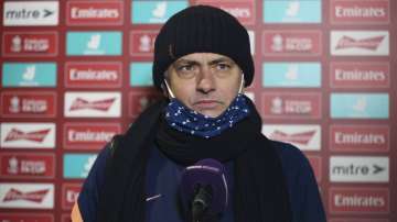 Tottenham's manager Jose Mourinho answers questions during an interview after his team's 5-0 win in the English FA Cup third round soccer match between Marine and Tottenham Hotspur at Rossett Park stadium in Crosby, Liverpool, Sunday, Jan. 10