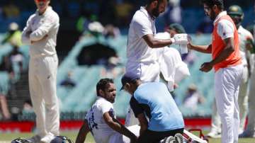 India's Hanuma Vihari receives treatment to a leg injury during play on the final day of the third cricket test between India and Australia at the Sydney Cricket Ground, Sydney, Australia, Monday, Jan. 11