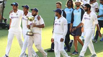 Indian players celebrate after defeating Australia by three wickets on the final day of the fourth cricket test at the Gabba, Brisbane, Australia, Tuesday, Jan. 19, 2021.