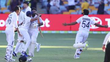 Indian players celebrate after defeating Australia by three wickets on the final day of the fourth cricket test at the Gabba, Brisbane, Australia, Tuesday, Jan. 19