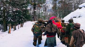 J&K: Army jawans wade through knee-deep snow to carry pregnant woman to hospital 