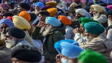 Farmers during their ongoing agitation against the farm reform laws, at the Singhu border in New Delhi.