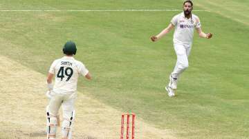 Mohammed Siraj of India celebrates the wicket of Steve Smith of Australia during day four of the 4th Test Match in the series between Australia and India at The Gabba on January 18