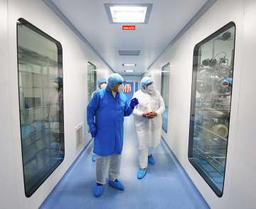 Hyderabad: Prime Minister Narendra Modi being briefed during a visit to the Bharat Biotech facility to review the development of indigenous COVID-19 vaccine candidate Covaxin, on the outskirts of Hyderabad, Saturday, Nov. 28, 2020.