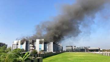 Smoke rises from the Serum Institute of India, the world's largest vaccine maker that is manufacturing the AstraZeneca/Oxford University vaccine for the coronavirus, in Pune.