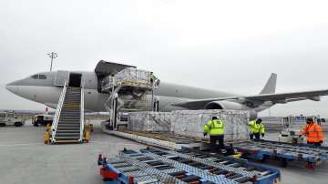 Boxes containing vaccines are unloaded from a Hungarian Airbus 330 cargo plane as the first batch of the vaccine against the new coronavirus produced by Sinopharm of China arrives at Budapest Liszt Ferenc International Airport in Budapest, Hungary.