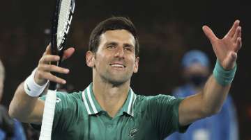 Serbia's Novak Djokovic celebrates after defeating France's Jeremy Chardy during their first round match at the Australian Open tennis championship in Melbourne, Australia, Monday, Feb. 8