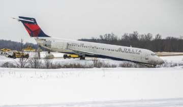 A Delta airplane is stuck in a large ditch at Pittsburgh International Airport in Moon Township.