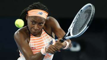 United States' Coco Gauff makes a backhand return to Ukraine's Elina Svitolina during their second round match at the Australian Open tennis championship in Melbourne, Australia, Thursday, Feb. 11