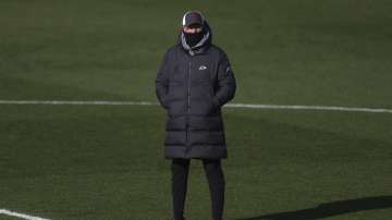 Liverpool's manager Jurgen Klopp watches his players during warm up prior to the English Premier League soccer match between Leicester City and Liverpool at the King Power Stadium in Leicester, England, Saturday, Feb. 13