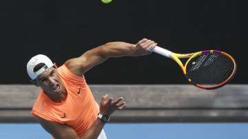 Spain's Rafael Nadal serves during a practice session ahead of the Australian Open in Melbourne, Australia, Sunday, Feb. 7