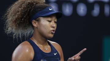 Japan's Naomi Osaka gestures during her second round match against France's Caroline Garcia at the Australian Open tennis championship in Melbourne, Australia, Wednesday, Feb. 10