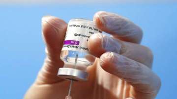 A health worker prepares a dose of the AstraZeneca vaccine to be administered at a vaccination centr