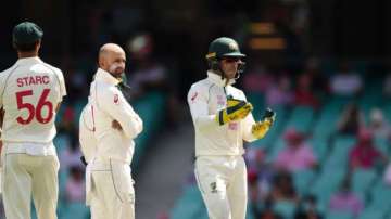 Tim Paine, Nathan Lyon and Mitchell Starc