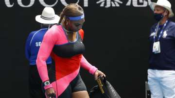 United States' Serena Williams carries her bags as she leaves th court after defeating Germany's Laura Siegemund in their first round match at the Australian Open tennis championship in Melbourne, Australia, Monday, Feb. 8
