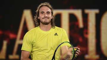 Greece's Stefanos Tsitsipas, smiles after defeating France's Gilles Simon after their first round match at the Australian Open tennis championship in Melbourne, Australia, Tuesday, Feb. 9