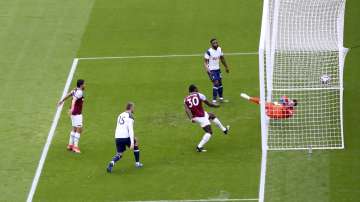West Ham's Michail Antonio, third left, scores his side's opening goal during the English Premier League soccer match between West Ham United and Tottenham at the London Stadium in London, Saturday, Feb. 21