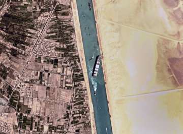 This satellite photo from Planet Labs Inc. shows the Ever Given cargo ship stuck in Egypt's Suez Canal Monday, March 29, 2021. 