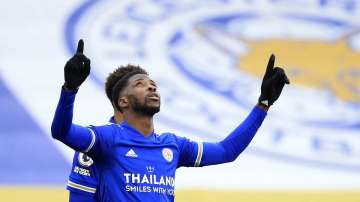 Leicester's Kelechi Iheanacho celebrates after scoring his side's third goal during the English Premier League soccer match between Leicester City and Sheffield United at the King Power Stadium in Leicester, England, Sunday, March 14