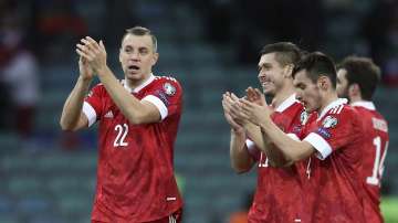 Russia's Artyom Dzyuba, left, reacts after the World Cup 2022 group H qualifying soccer match between Russia and Slovenia at the Fisht Olympic Stadium in Sochi, Russia, Saturday, March 27