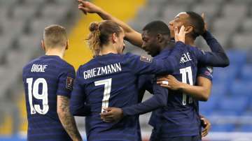 France players celebrate after France's Ousmane Dembele, second right, scored his side's opening goal during the World Cup 2022 group D qualifying soccer match between Kazakhstan and France