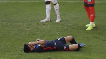 United States' Sebastian Soto grimaces in pain during a Concacaf Men's Olympic qualifying championship semi-final soccer match against Honduras in Guadalajara, Mexico, Sunday, March 28