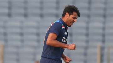 Bhuvneshwar Kumar of India celebrates after taking the wicket of Jason Roy of England during the 3rd One Day International match between India and England at MCA Stadium on March 28