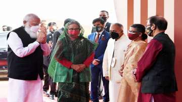 Prime Minister Narendra Modi being welcomed by Prime Minister of Bangladesh Sheikh Hasina and other dignitaries on his arrival at the National Day programme of Bangladesh, in Dhaka.