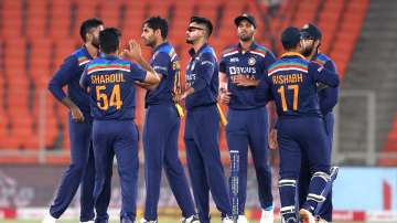 Bhuvneshwar Kumar of India celebrates with team mates after bowling Jason Roy of England during the 5th T20 International between India and England at Narendra Modi Stadium on March 20