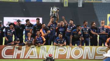 Players and Staff of India pose with the trophy after winning the ODI series during the 3rd One Day International match between India and England at MCA Stadium on March 28