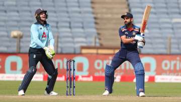 England wicketkeeper Jos Buttler celebrates after catching out India batsman Virat Kohli off the bowling of Adil Rashid during the 2nd One Day International between India and England at MCA Stadium on March 26