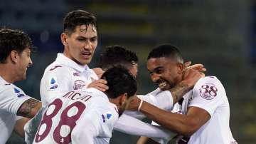 Torino's Gleison Bremer, right, celebrates with teammates after scoring a goal during a Serie A soccer match between Cagliari and Torino, in Cagliari’s Sardegna Arena stadium, Italy, Friday, Feb. 19