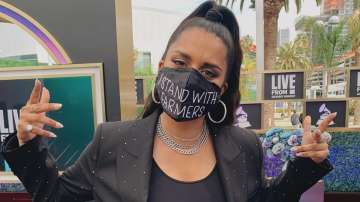 Lilly Singh wears 'I stand with farmers' mask at Grammys red carpet