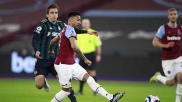 West Ham's Jesse Lingard scores his side's opening goal during the English Premier League soccer match between West Ham United and Leeds United at the London Stadium in London, England, Monday, March 8