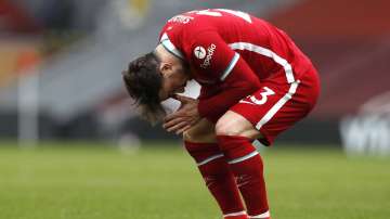 Liverpool's Xherdan Shaqiri reacts after missing a scoring chance during the English Premier League soccer match between Liverpool and Fulham at Anfield stadium in Liverpool, England, Sunday, March 7