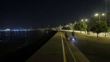A police officer patrols on a Segway on the Marine Drive promenade during a night curfew imposed by the authorities following the rise in COVID-19 cases in Mumbai.