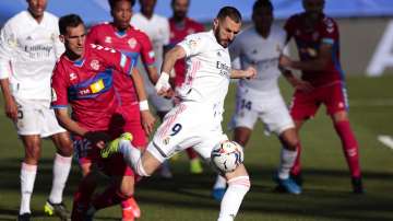 Benzema’s late brace earned Madrid a 2-1 win over Elche on Saturday, cutting into Atlético’s lead at the top after it was held 0-0 at 10-man Getafe.