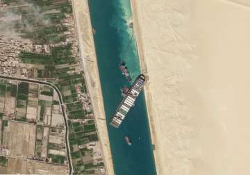 Satellite file image from Planet Labs Inc, the cargo ship MV Ever Given sits stuck in the Suez Canal