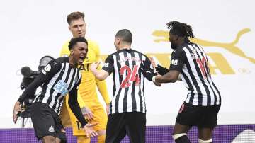 Newcastle's Joe Willock, left, celebrates with teammates after scoring his side's second goal during the English Premier League soccer match between Newcastle United and Tottenham Hotspur at St. James' Park in Newcastle, England, Sunday, April 4