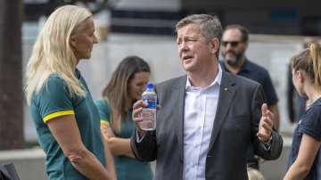 Matt Carroll, right, CEO of the Australian Olympic Committee, chats with former Australian Olympic beach volleyballer and gold medalist Kerri Pottharst at a ceremony to mark 100 days before the start of the Tokyo Olympics in Sydney Wednesday, April 14