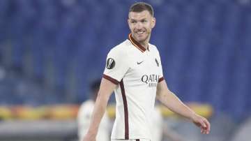 Roma's Edin Dzeko celebrates after scoring his side's opening goal during the Europa League second leg quarterfinal soccer match between Roma and Ajax at Rome's Olympic stadium, Italy, Thursday, April 15