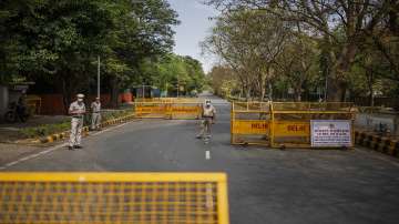 Delhi Police officers stand at a check point during a weekend lockdown in New Delhi.