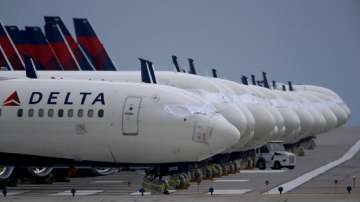 Delta cancels over 100 flights, opens some middle seats